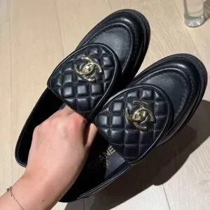 CHANEL Black Loafers with Gold Logo